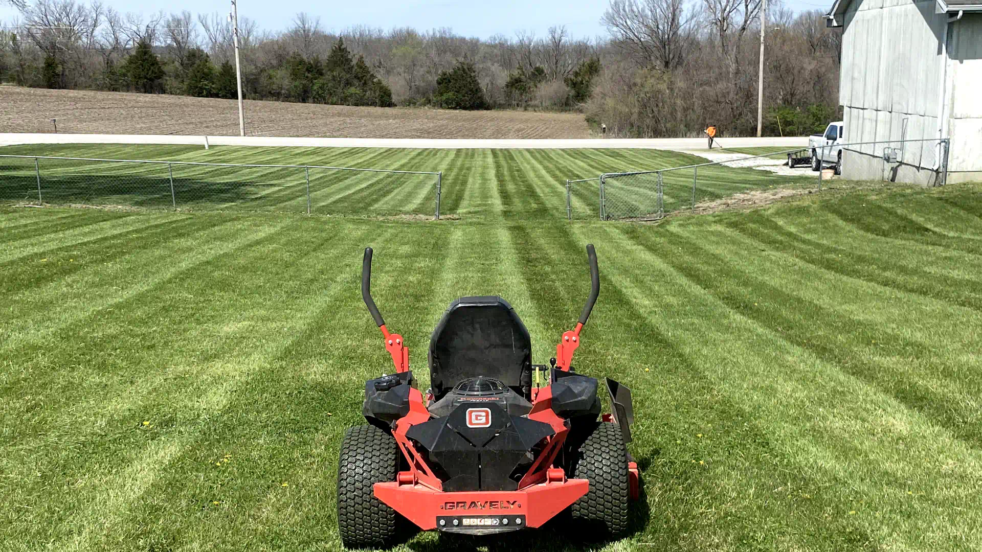 lawn mower in a neatly trimmed lawn 2